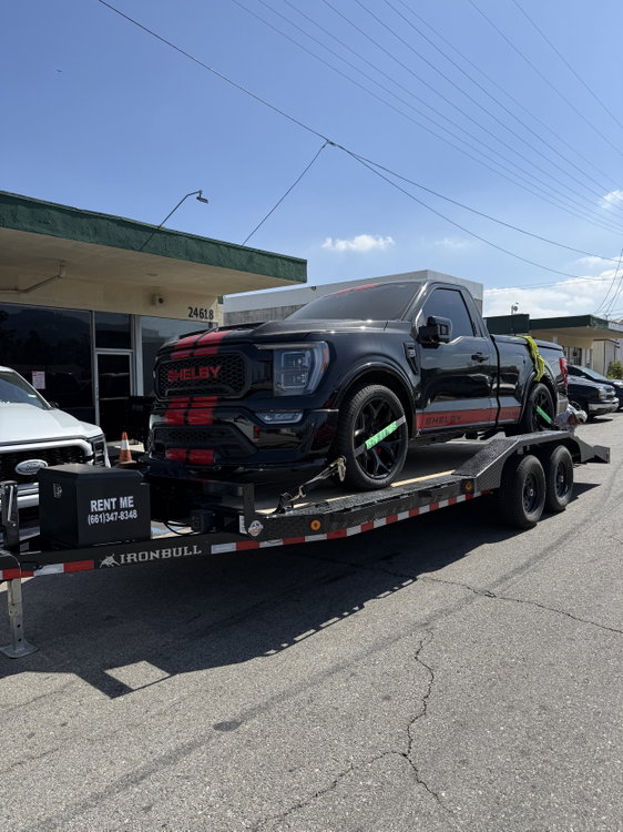 A Tesla Model Y loaded and strapped on our car hauler. It’s a good option for EVs and vehicles that shouldn’t be flat-towed.